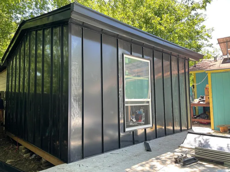 Black standing seam metal wall panels for Roof Inspection in Bellmead